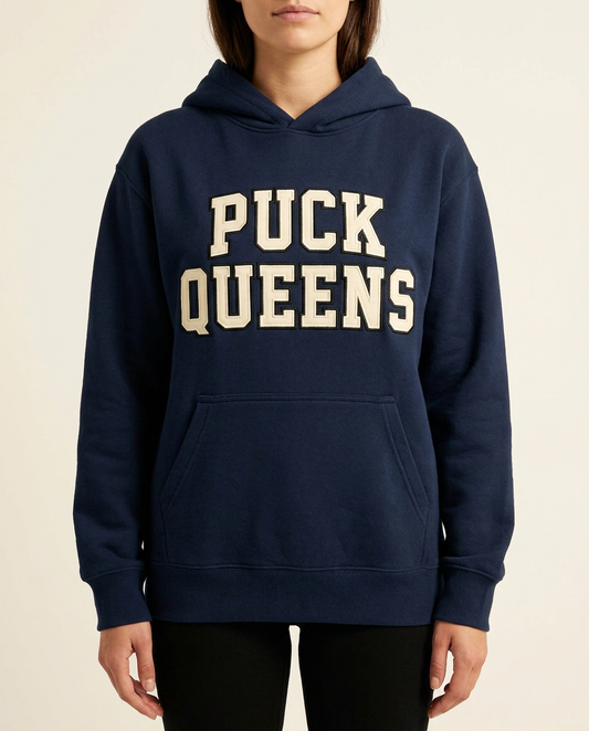 Navy Puck Queens varsity hoodie with cream tackle twill appliqué lettering, worn